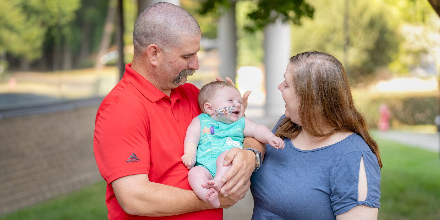 Davis and Shanna Hodges hold their son, Eli, after a clinic visit in Durham, NC. Davis and Shanna Hodges hold their son, Eli, after a clinic visit in Durham, NC.