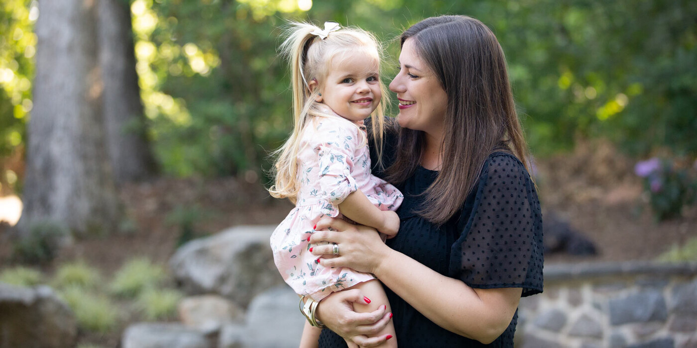 Holly VanHorn holds her daughter Nessa outside the family's home in Raleigh, NC. Holly VanHorn holds her daughter Nessa outside the family's home in Raleigh, NC.