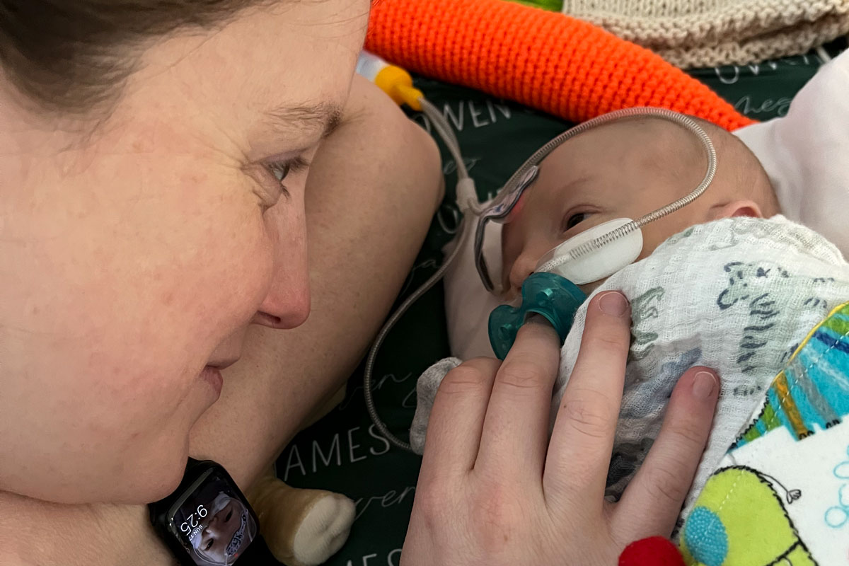 Owen's mother spends time with her newborn son.